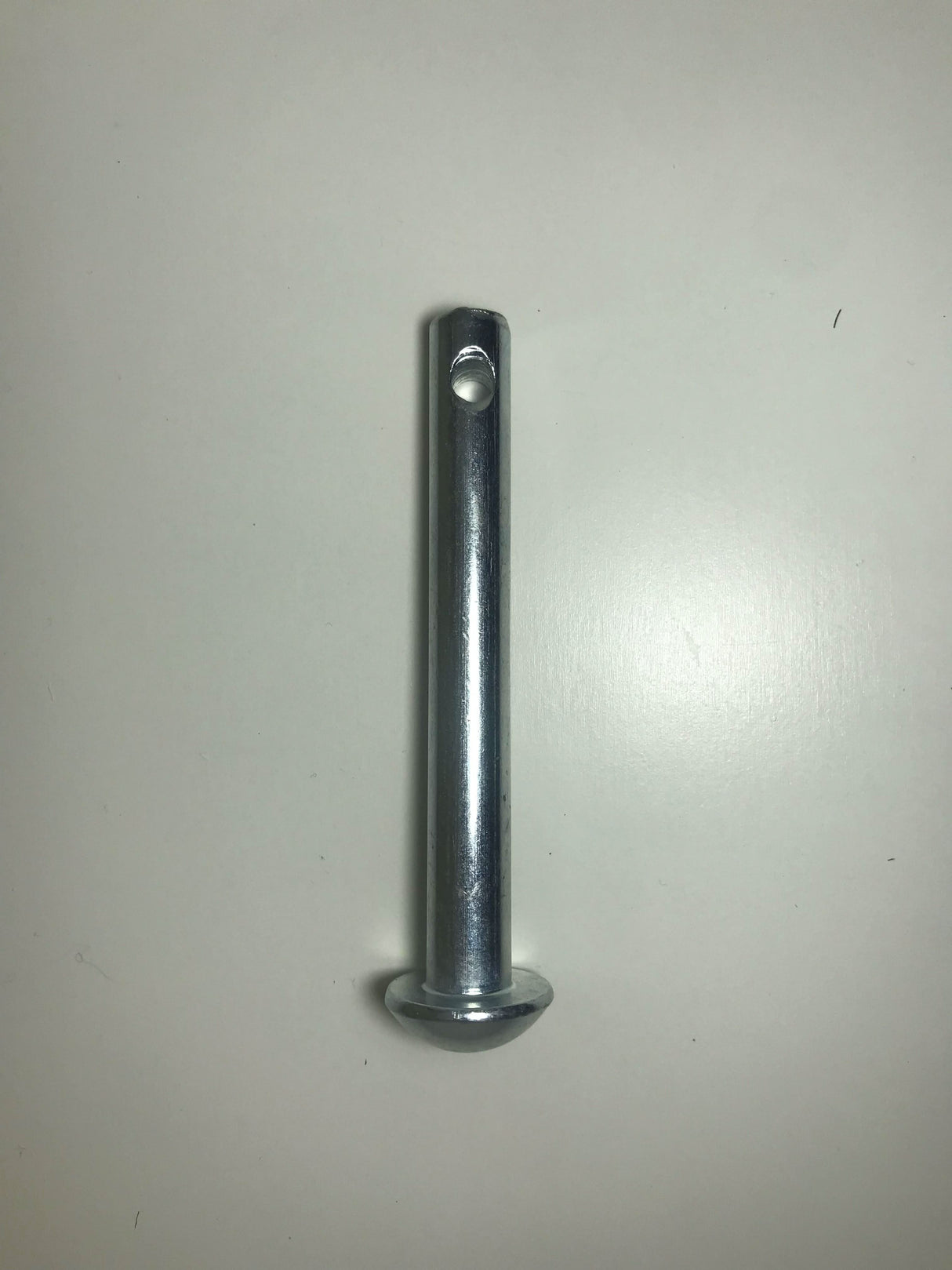 Metal rod with threaded end on a white background