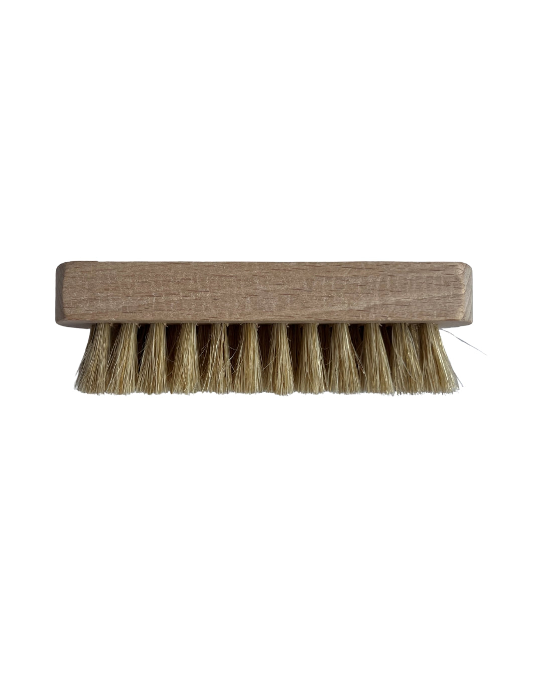 Brick-shaped brush with bristles on a white background