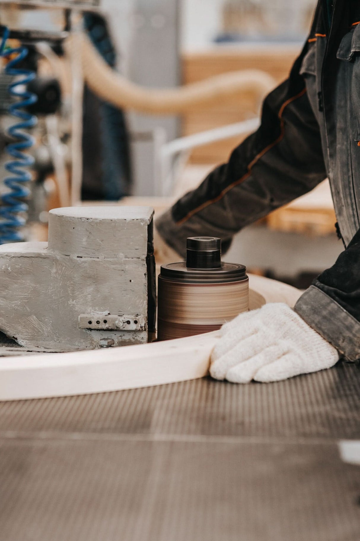 Person using a concrete grinder on a floor