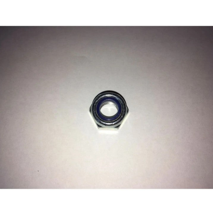 Metal hex nut on a light gray background