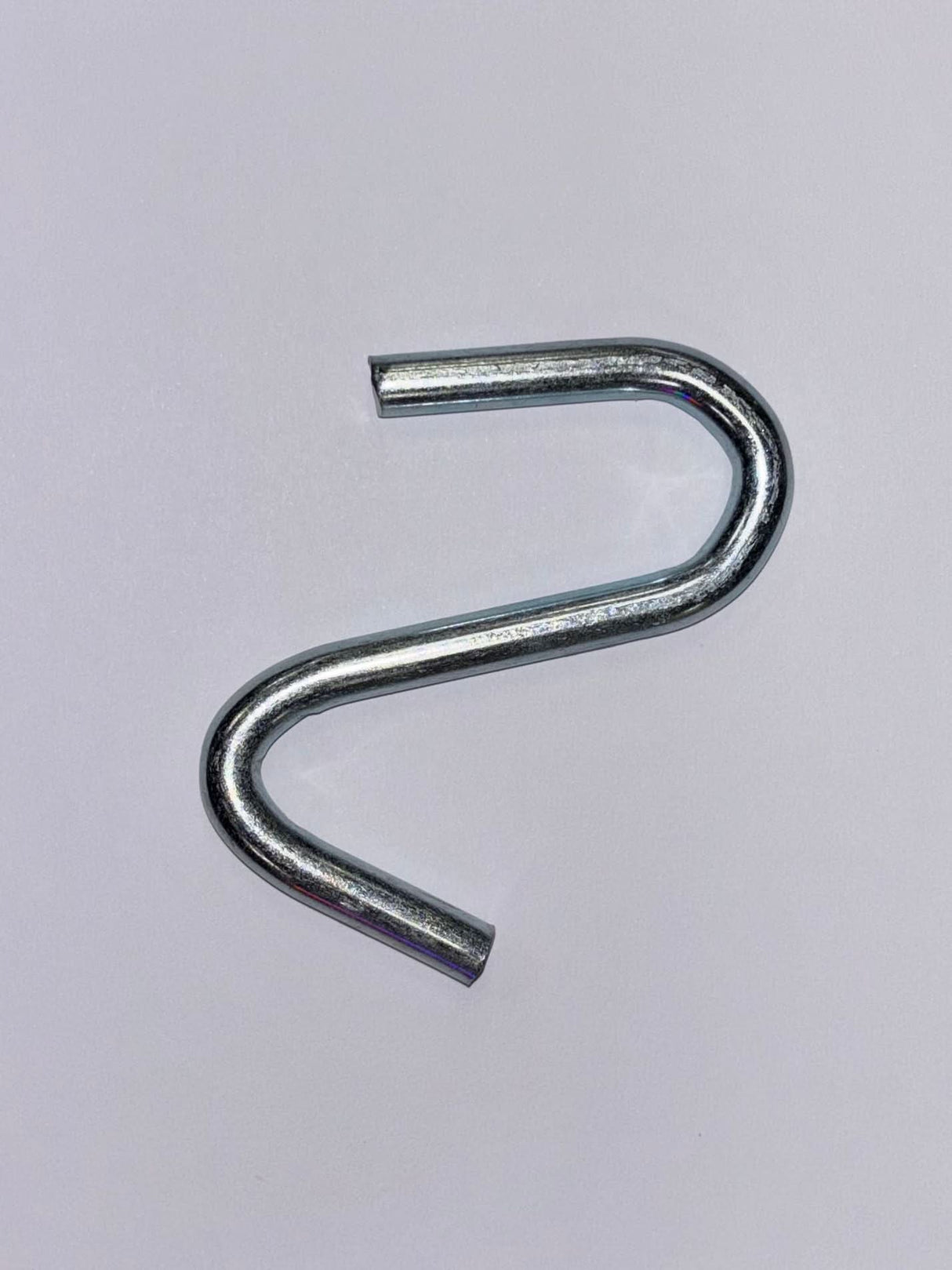 Metal S-hook on a white background