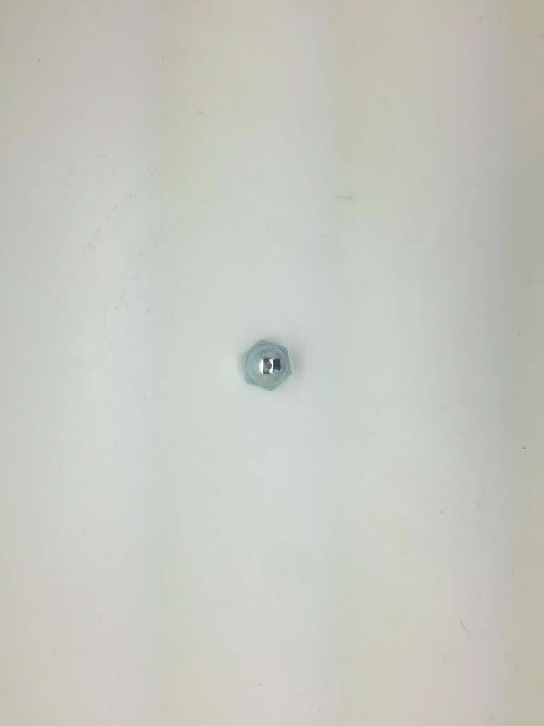 Small round object on a light grey background