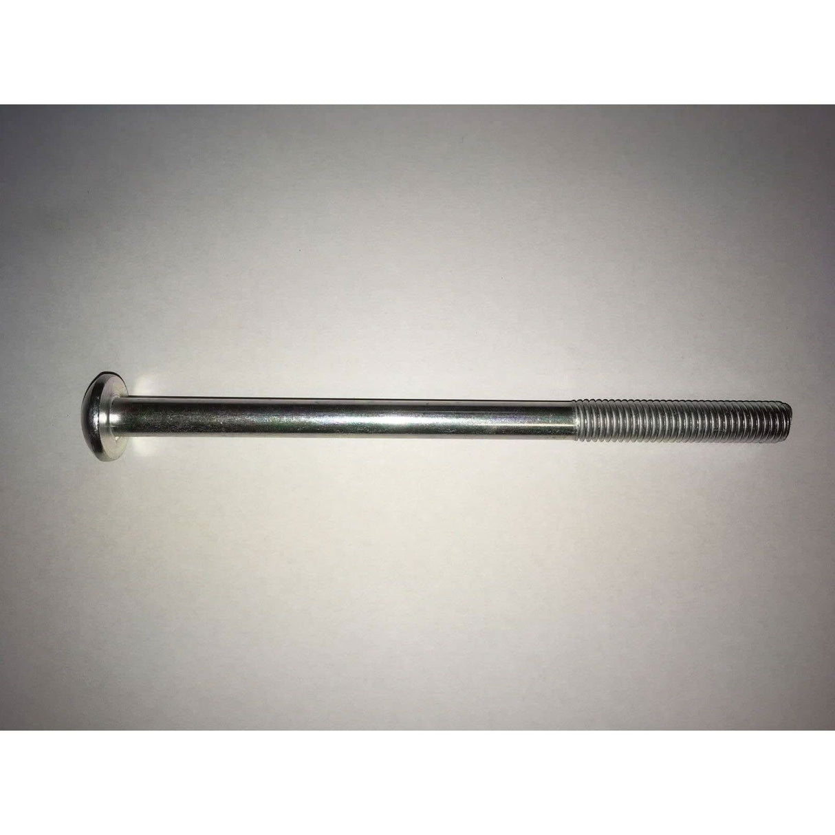 Metal screw on a grey background