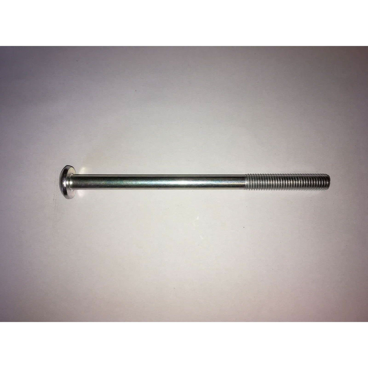 Metal threaded rod on a grey background