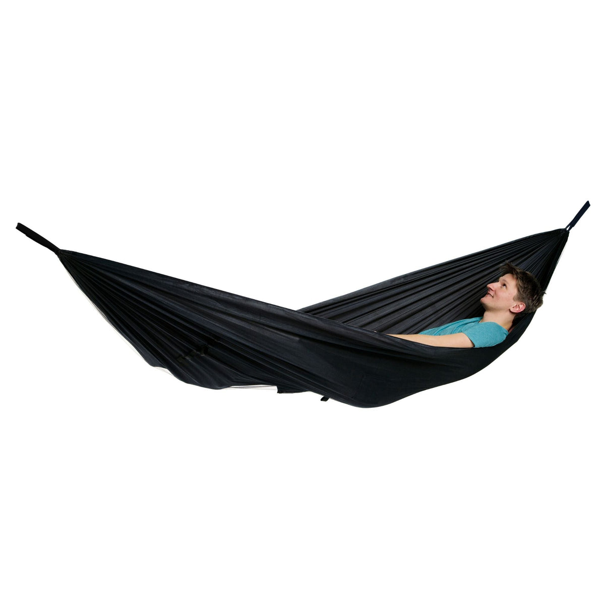 A person lying in a black hammock against a plain white background.