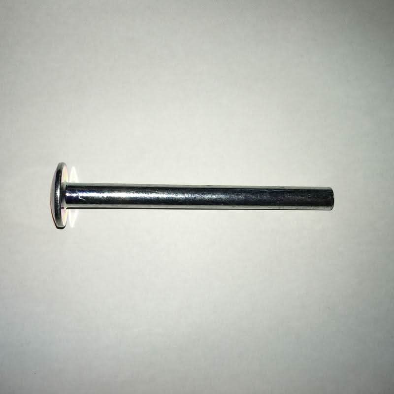 Metal rivet on a light grey background