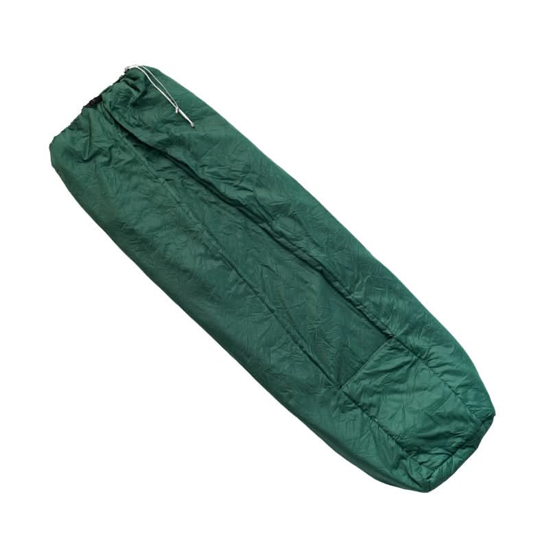 Green sleeping bag on a white background