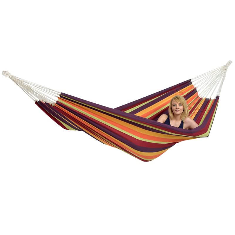 Colourful striped hammock with a person sitting inside on a white background