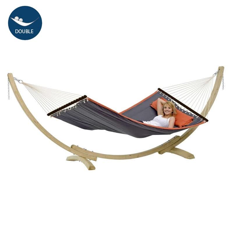 Hammock with wooden stand and a person inside on a white background