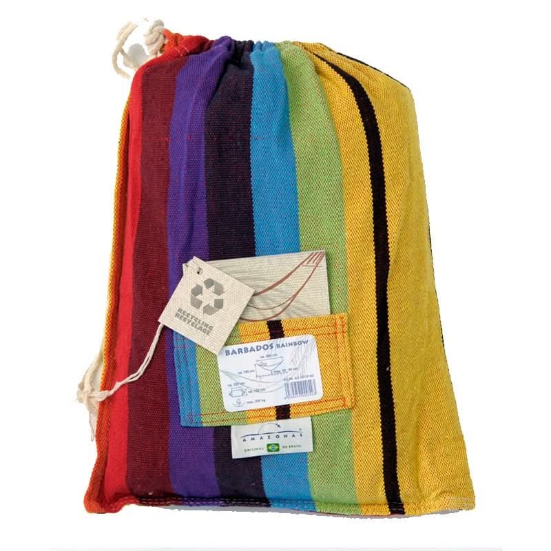 Colourful striped towel in a drawstring bag with a tag on a white background
