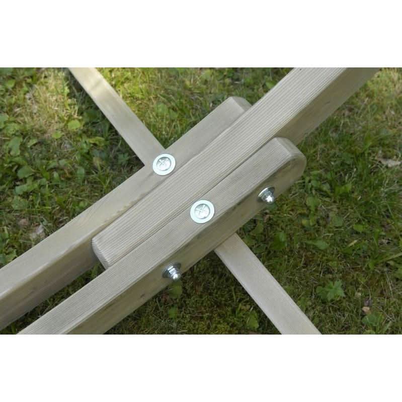 Wooden bench with metal brackets on a grassy background