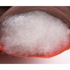 Close-up of a white powdery substance with a red border