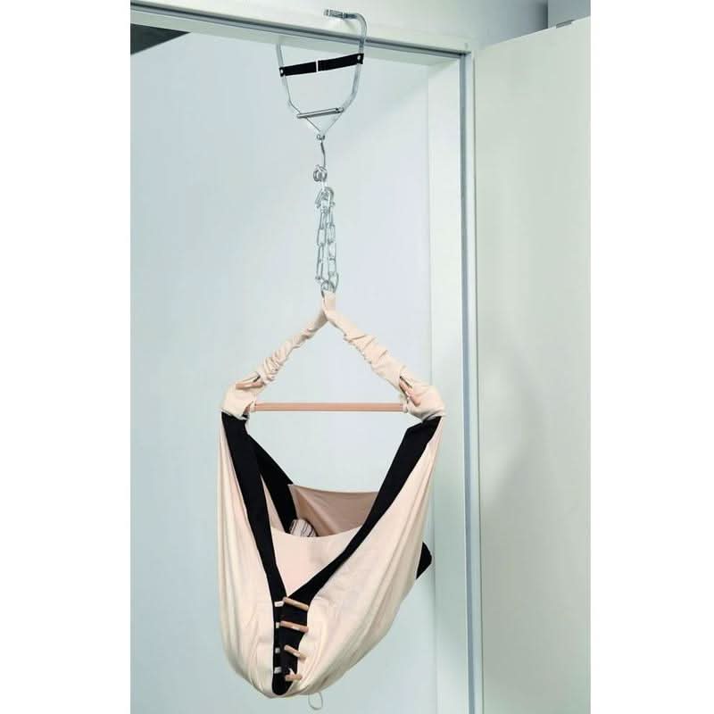 Baby hammock hanging from a hook on a shower door.