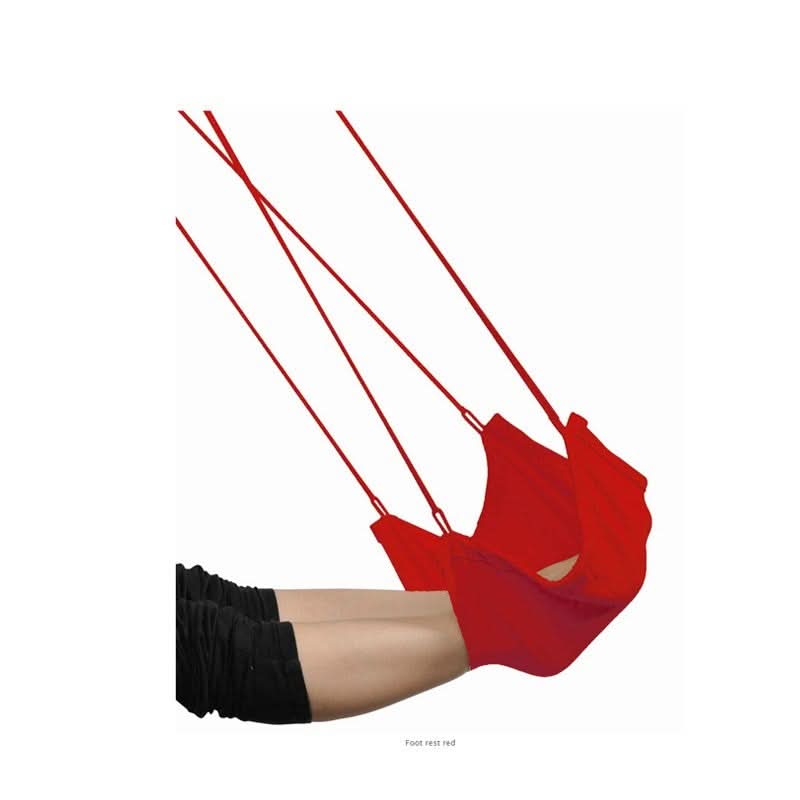 Red hammock swing with a person's leg and foot on a white background