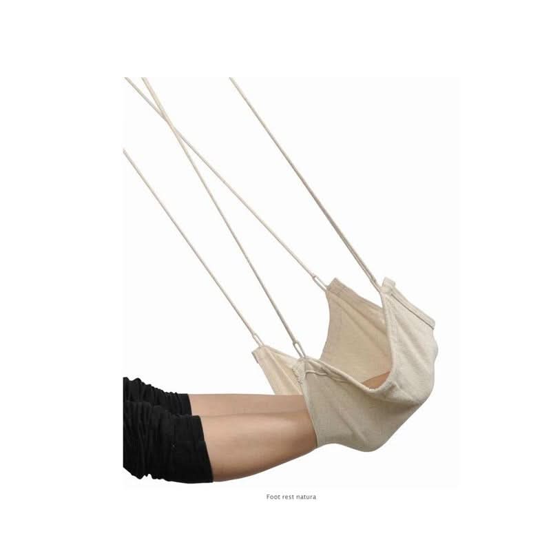 Beige baby hammock suspended by strings on a white background