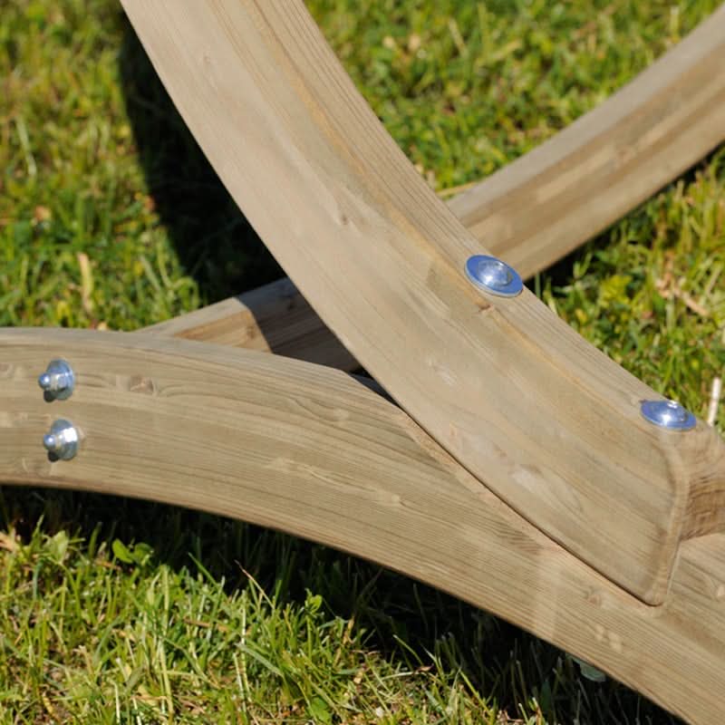 Wooden swing set with blue bolts on a grassy background
