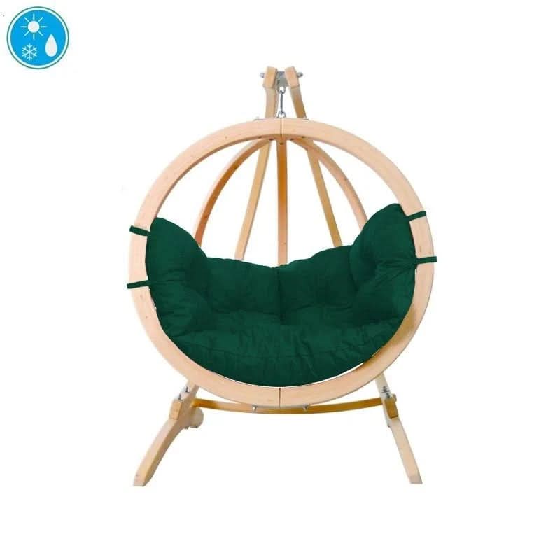 Hanging chair with green cushion and wooden frame on a white background
