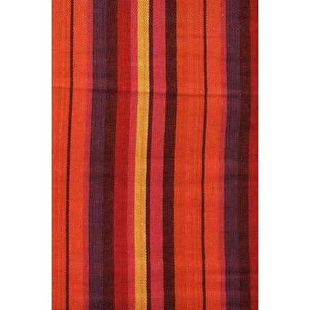 Striped fabric with red, orange, and purple colors on a white background