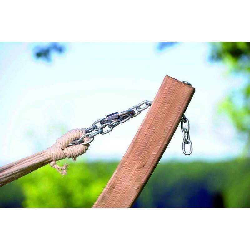 Wooden swing with rope and metal chain against a blurred natural background