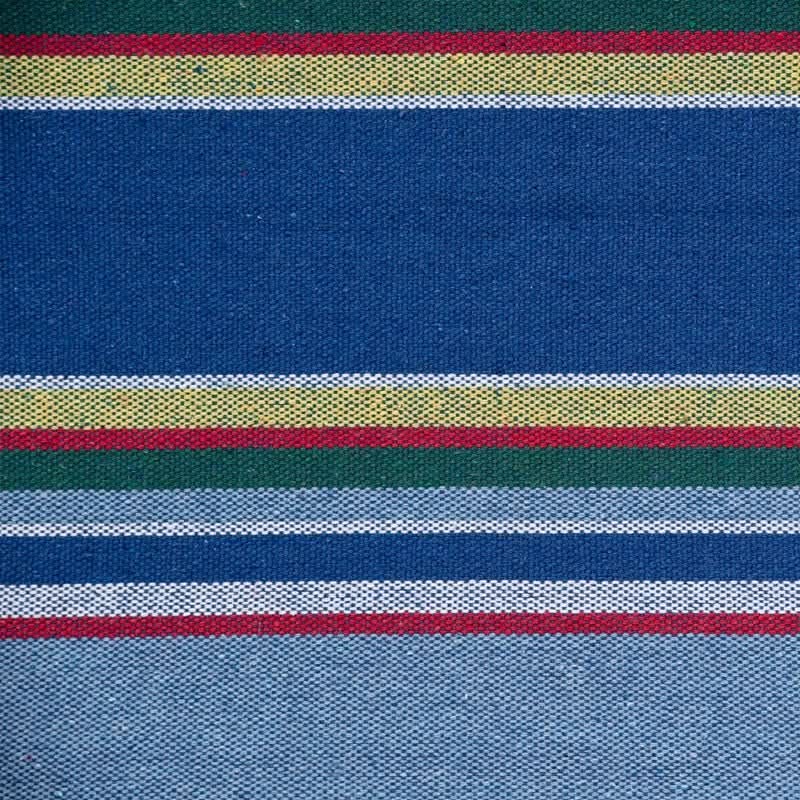 Close-up of fabric with multicolored stripes on a blue background