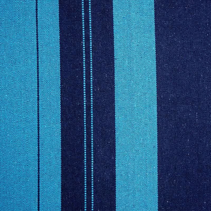 Close-up of blue and navy striped fabric with visible stitching.
