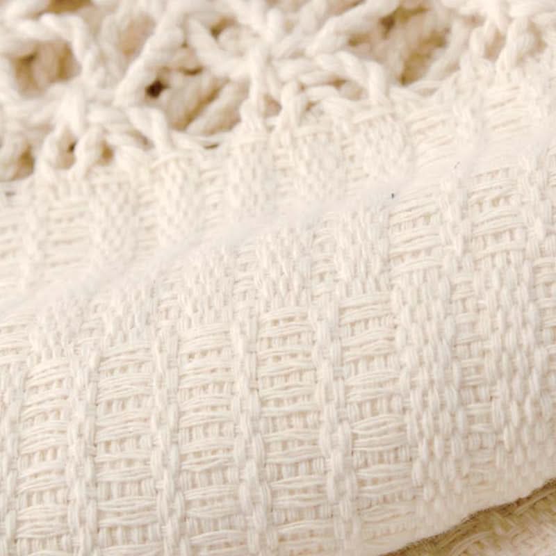 Close-up of textured white fabric with a subtle pattern