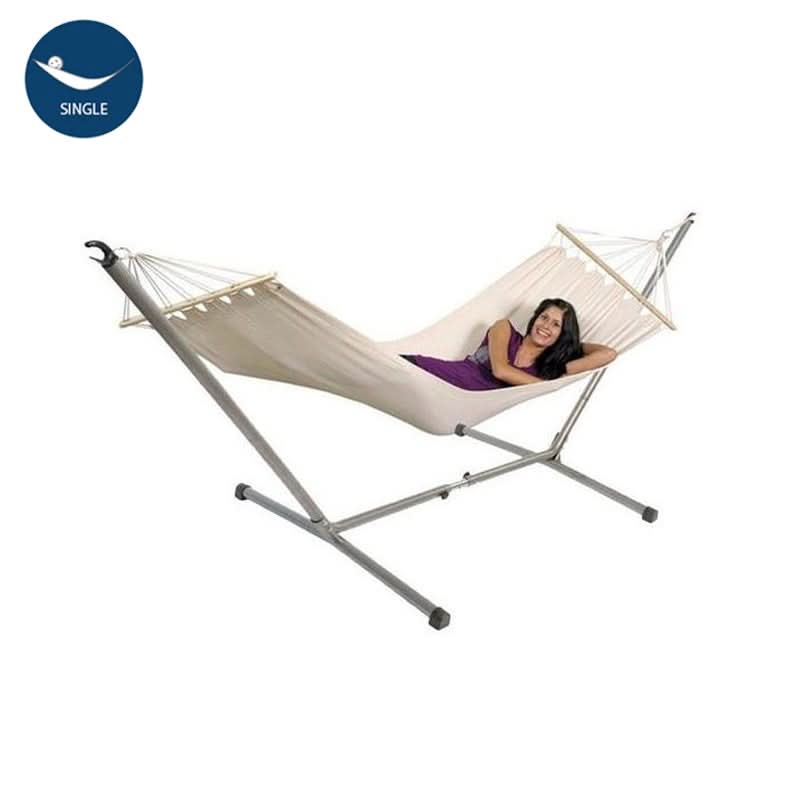 Beige hammock with metal stand on a white background