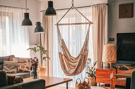 The Brasil Cappuccino hammock hanging indoors in a living space. 