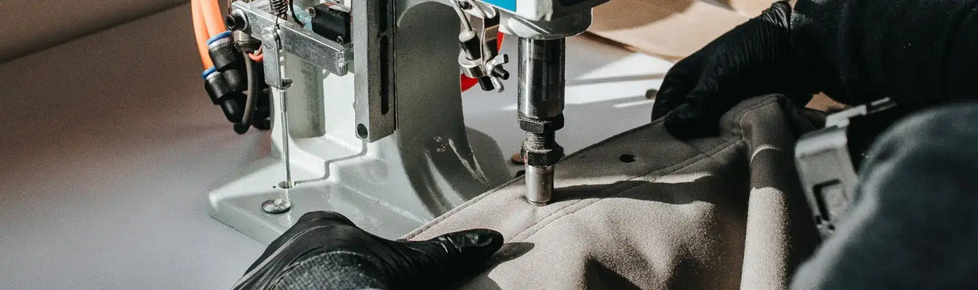 hole punch machine being used inside of a factory 