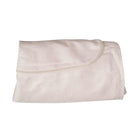 Folded beige sheet on a white background