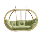 Hanging chair with green cushion on a white background