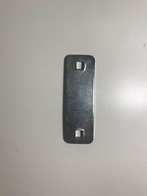 Metallic object on a light grey background