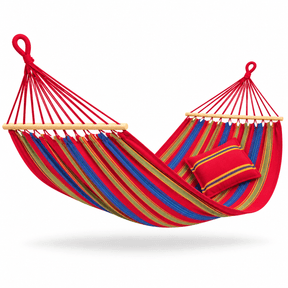 A red fabric hammock with blue, green, and yellow stripes, featuring light wood spreader bars and a matching red striped pillow, shown against a plain white background.