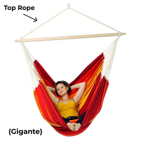 Person relaxing in a red and orange hammock with labels 'Top Rope' and 'Gigante' on a white background.
