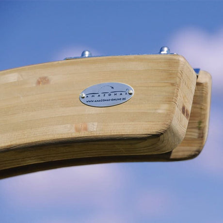 Wooden product with a brand label against a blue sky