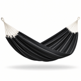 A black fabric hammock with thin white stripes and cream-colored suspension ropes, suspended against a plain white background.