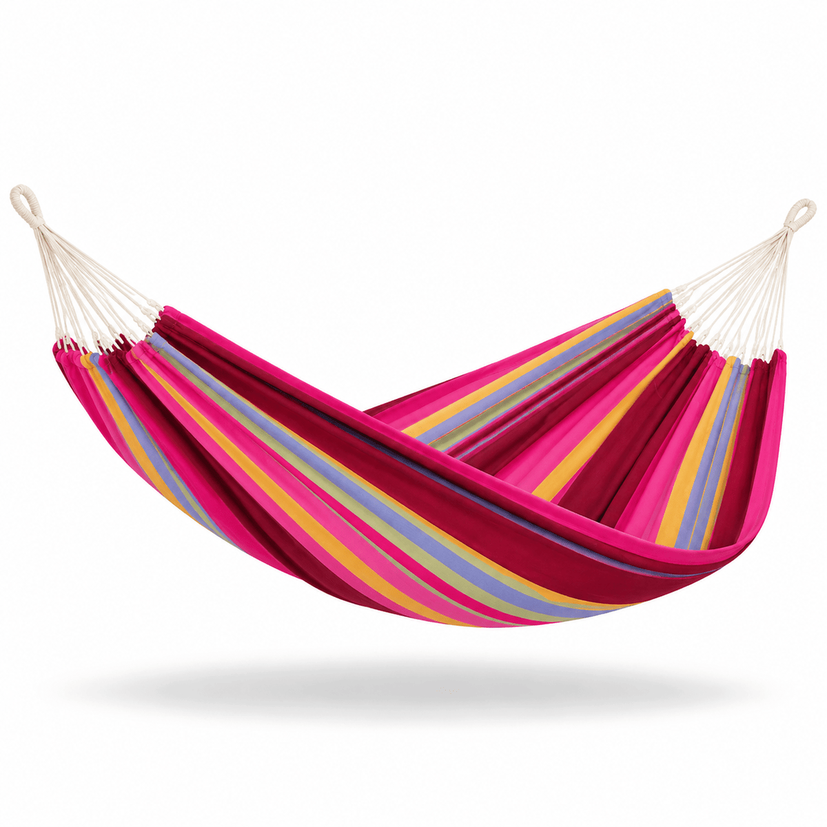 A striped fabric hammock suspended between two off-white ropes, featuring bold stripes of magenta pink, dark red, yellow, and light blue on a clean white background.