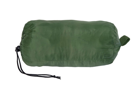 Green compression sack on a white background