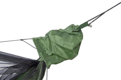 Green hammock rain cover attached to a hammock on a white background