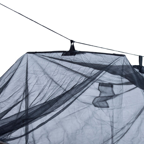 Close-up of a black hammock with mosquito netting on a white background