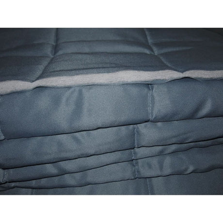 Stack of blue quilted items on a white background