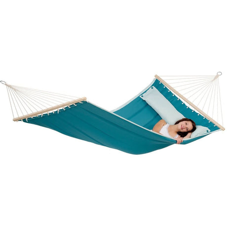 Teal hammock with a person lying on it on a white background