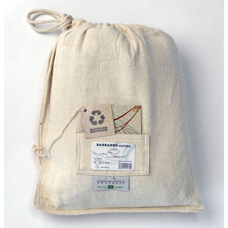 Beige drawstring bag with labels on a white background