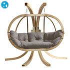 Hanging chair with wooden frame and grey cushion on a white background