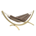 Brown hammock with white accents on a wooden stand against a white background