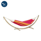 Colourful hammock with wooden stand on a white background