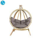 Hanging chair with wooden frame and grey cushions on a white background