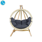 Hanging chair with dark grey cushions on a white background