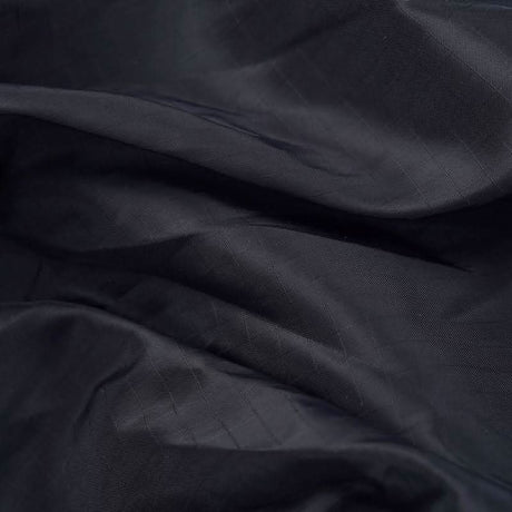 Close-up of dark blue fabric with a subtle pattern