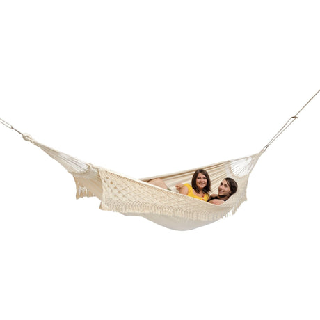 Two people in a beige hammock on a white background